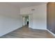 Bright living room featuring wood floors and an accent wall at 7132 Mission Hills Dr, Las Vegas, NV 89113
