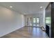 Large living area features new floors, neutral paint, recessed lighting and views of the backyard at 7132 Mission Hills Dr, Las Vegas, NV 89113