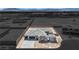 Newly constructed home features a desert landscape, with stone accents, a paved driveway and a spacious two-car garage at 7141 Painted Skyline St, Las Vegas, NV 89118