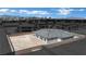 An exterior view of the newly constructed home featuring a desert landscape, with backyard privacy wall at 7141 Painted Skyline St, Las Vegas, NV 89118