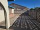 Concrete backyard patio area with decorative cement fence and block wall at 725 Brick Dr, Henderson, NV 89002