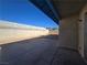 Large concrete patio in the backyard, enclosed by a tall block wall, offers ample outdoor space at 725 Brick Dr, Henderson, NV 89002