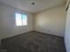 Bedroom featuring neutral paint, carpet, and a window at 725 Brick Dr, Henderson, NV 89002
