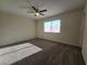 Bedroom featuring neutral paint, carpet, ceiling fan, and window at 725 Brick Dr, Henderson, NV 89002