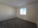 Bedroom featuring neutral paint, carpet, and a window at 725 Brick Dr, Henderson, NV 89002