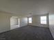 Living room features grey carpet, neutral paint, and natural light at 725 Brick Dr, Henderson, NV 89002
