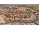 A picturesque aerial view of an attractive community with a pool and meticulously kept landscape at 731 Appletree Ln, Mesquite, NV 89027