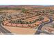 An aerial view of a desert community of homes with red tiled roofs at 731 Appletree Ln, Mesquite, NV 89027
