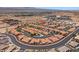 A picturesque aerial view of an attractive community with a pool and meticulously kept landscape at 731 Appletree Ln, Mesquite, NV 89027