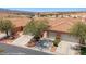 Aerial view of the neighborhood showcasing the home with a terracotta roof and xeriscaped front yard at 731 Appletree Ln, Mesquite, NV 89027