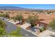 Community aerial view showcasing tile roofs and desert landscaping in a peaceful neighborhood setting at 731 Appletree Ln, Mesquite, NV 89027