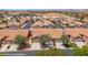 An aerial view of a desert community of homes with red tiled roofs at 731 Appletree Ln, Mesquite, NV 89027
