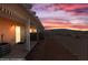 Scenic balcony view of mountains, desert landscape, and beautiful sunset at 731 Appletree Ln, Mesquite, NV 89027