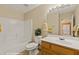 Bathroom with a tub/shower combination and white tiled walls at 731 Appletree Ln, Mesquite, NV 89027