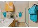 Bathroom with a wood cabinet, mirror and decorative towel rack at 731 Appletree Ln, Mesquite, NV 89027