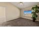 Carpeted bedroom with vaulted ceiling and bright window with a view at 731 Appletree Ln, Mesquite, NV 89027