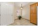 Entryway featuring tile flooring, a window, and a light fixture at 731 Appletree Ln, Mesquite, NV 89027