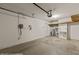 Clean two-car garage with white walls, overhead lighting, and plenty of storage space at 731 Appletree Ln, Mesquite, NV 89027