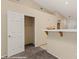 Hallway leading to an open closet, adjacent to a kitchen breakfast bar at 731 Appletree Ln, Mesquite, NV 89027