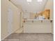 Bright kitchen with breakfast bar and skylights open to living area at 731 Appletree Ln, Mesquite, NV 89027