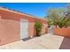 Outdoor patio featuring a convenient door and a charming gate leading to landscaped surroundings at 731 Appletree Ln, Mesquite, NV 89027
