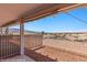Enjoy the desert view from this home's covered patio and white metal fence surround at 731 Appletree Ln, Mesquite, NV 89027