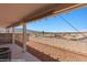 Enjoy the desert view from this home's covered patio and white metal fence surround at 731 Appletree Ln, Mesquite, NV 89027
