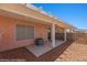 Comfortable covered patio with AC unit, desert landscaping, and views at 731 Appletree Ln, Mesquite, NV 89027