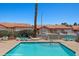 View of the community pool with lounge seating surrounded by desert landscaping at 731 Appletree Ln, Mesquite, NV 89027