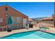 Poolside view of community pool with showers, hot tub and Mountain views at 731 Appletree Ln, Mesquite, NV 89027