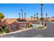 Community pool area with tall palm trees, well-maintained landscaping, and plenty of parking at 731 Appletree Ln, Mesquite, NV 89027