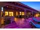 A beautiful outdoor patio with lounge chairs, a hot tub, and string lights for cozy evening gatherings at 741 Canary Wharf Dr, Las Vegas, NV 89178