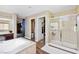 Spacious bathroom with a soaking tub, glass shower, and access to rooms at 741 Canary Wharf Dr, Las Vegas, NV 89178