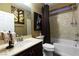 Neutral bathroom featuring a shower over tub, with framed art and dark wood vanity at 741 Canary Wharf Dr, Las Vegas, NV 89178