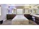 Lavish bathroom featuring a soaking tub, dual vanities, and makeup area at 741 Canary Wharf Dr, Las Vegas, NV 89178