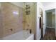 Clean bathroom featuring a shower-tub, and neutral tiling at 741 Canary Wharf Dr, Las Vegas, NV 89178