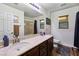 Bright bathroom featuring double sinks, and a large mirror at 741 Canary Wharf Dr, Las Vegas, NV 89178