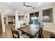 Well-lit dining area with a view to the backyard and living area at 741 Canary Wharf Dr, Las Vegas, NV 89178
