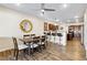 Open-concept dining area with a view to the kitchen and bar seating at 741 Canary Wharf Dr, Las Vegas, NV 89178