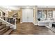 Home entryway featuring a staircase, double doors, and views to the living and dining rooms at 741 Canary Wharf Dr, Las Vegas, NV 89178
