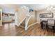 Inviting entryway with wood floors, staircase, and adjacent dining area at 741 Canary Wharf Dr, Las Vegas, NV 89178