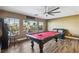 Entertainmant room featuring a pool table, leather sofa, and natural light at 741 Canary Wharf Dr, Las Vegas, NV 89178