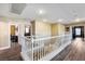Upstairs hallway with white railings leads to multiple bedrooms and living spaces at 741 Canary Wharf Dr, Las Vegas, NV 89178