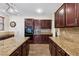 Spacious kitchen with dark cabinetry, stainless steel appliances, and an island at 741 Canary Wharf Dr, Las Vegas, NV 89178
