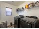 Functional laundry room with modern washer and dryer units at 741 Canary Wharf Dr, Las Vegas, NV 89178