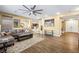 Inviting living room with hardwood floors, large windows, and a comfortable sectional sofa at 741 Canary Wharf Dr, Las Vegas, NV 89178