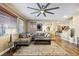 Inviting living room with hardwood floors, large windows, and a comfortable sectional sofa at 741 Canary Wharf Dr, Las Vegas, NV 89178
