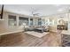 Bright living room features wood floors, large windows, and comfortable seating area at 741 Canary Wharf Dr, Las Vegas, NV 89178