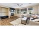 Inviting living room with hardwood floors, large windows, and a comfortable sectional sofa at 741 Canary Wharf Dr, Las Vegas, NV 89178