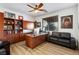 Home office with built-in cabinets and a comfortable seating area at 741 Canary Wharf Dr, Las Vegas, NV 89178